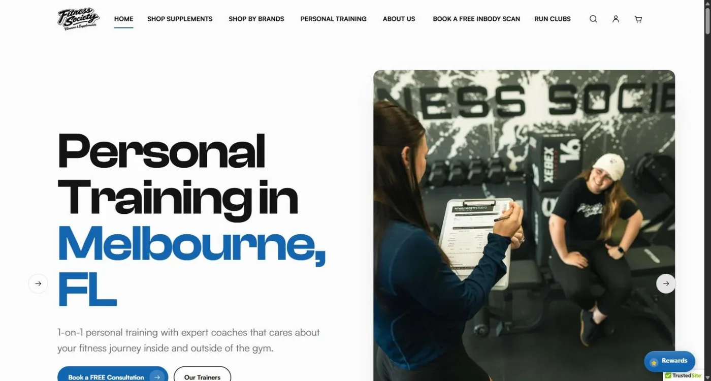 The Fitness Society Supplements homepage: the script Fitness Society logo and a navigation for supplements, brands, personal training, InBody scans and run clubs, over the headline Personal Training in Melbourne, FL beside a photo of a coach with a client in the gym